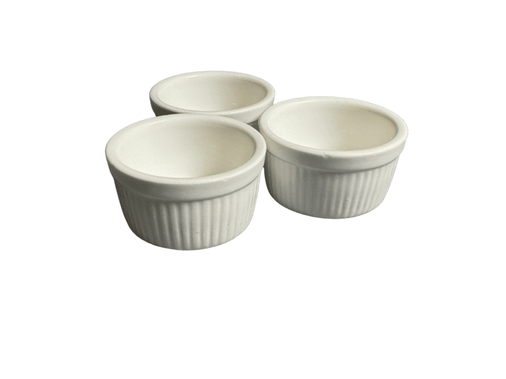 Set of three white ceramic baking ramekins with fluted sides